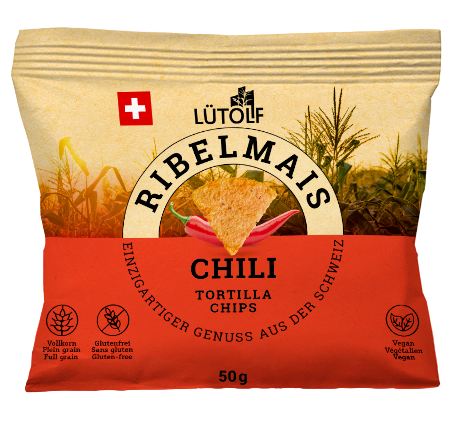 Chips de tortilla au chili 50g LÜTOLF Ribelmais Tortilla Chips are made using the original Mexican method from whole maize kernels and contain important dietary fiber.  The chili variety is spicy hot. The main ingredient is 100% Swiss Ribelmais. The entire value creation takes place in Eastern Switzerland.