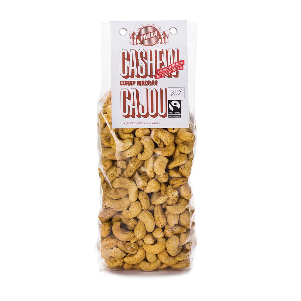 Cashew geröstet mit Curry Madras, bio & fair, 450g Les noix de cajou sont cultivées en Inde. Elles sont appréciées pour leur goût très fin et doux ainsi que pour les précieuses substances nutritives qu'elles fournissent au corps comme à l'esprit. Un excellent mélange de Curry de Madras se compose de 30 épices au moins qui se répondent et s'assemblent parfaitement. Grâce à elles, nos noix de cajou se teintent d'une saveur exotique.+ biologiques & équitables+ sans gluten+ sans lactose+ vegan